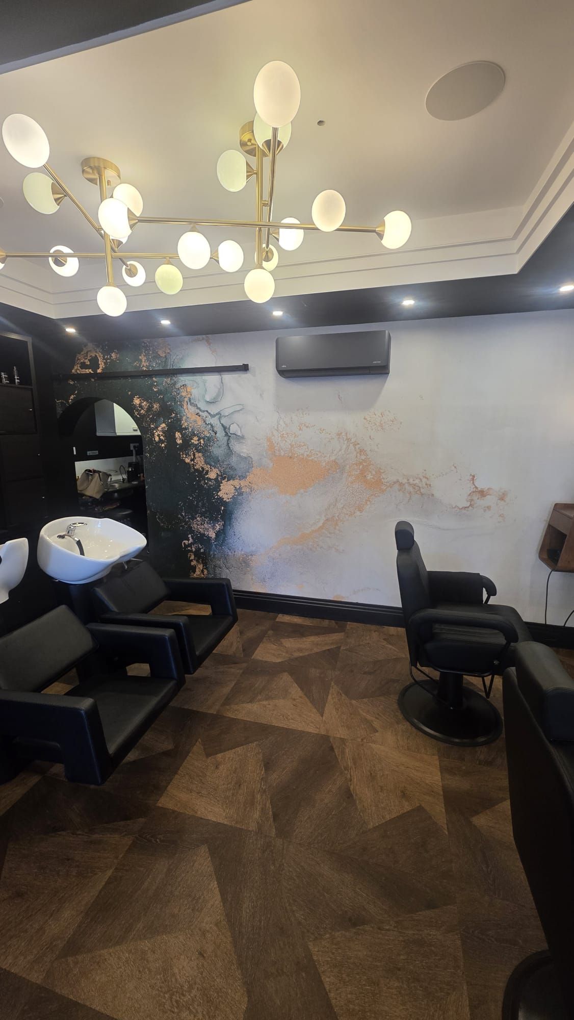 Salon feature wall after wallpapering